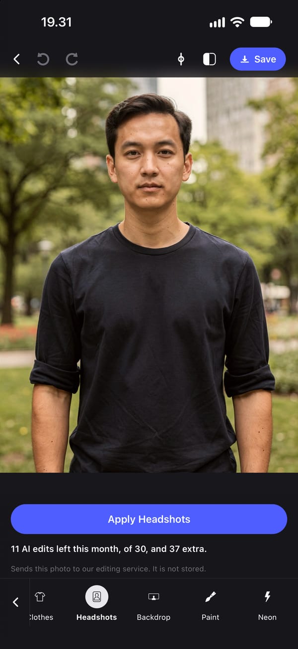 The Headshots tool before it is applied, on a waist-up photo of a young man in a black T-shirt standing in a park, above a single Apply Headshots button.